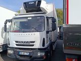 a truck that is parked next to another truck