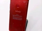 the back of a red cell phone with a display on it