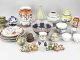 many different types of vases and bowls on the table