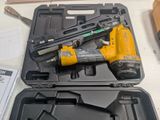 a yellow and black stapler in a black case