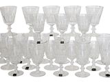 a lot of wine glasses that are sitting on the table