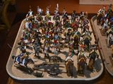 a lot of figurines that are sitting on a table
