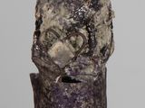 an image of a sculpture of a man with a hat on his head
