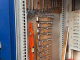 a picture of a garage with tools and tools on the wall