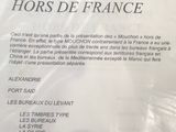 une affiche accrochée au mur sur laquelle on peut lire « Letye Mouchon hors de France »