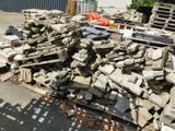 a large pile of rubble sitting on the side of the road