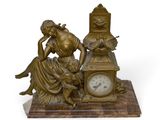 a statue of a woman sitting on a table with a clock