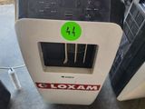 a machine that has a green sticker on it