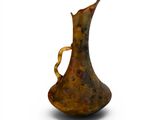 a brown vase with a curved handle on a white surface