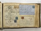 a book with a lot of old stamps on it