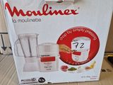 packaging of a blender sitting on top of a cardboard box on a table