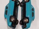 two toy cars that are sitting on top of each other