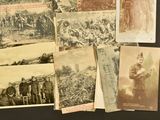 several old photographs of men in military uniforms are displayed on a table