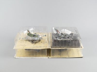 deux bacs en plastique contenant des plantes, posés sur une table