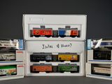 a small assortment of toy trains in a display case