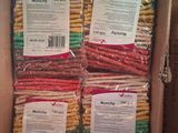 several packages of macaroni sitting in a box on top of a table