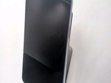 a cell phone that is sitting on top of a stand