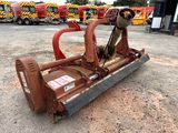 a red machine that is sitting in the dirt