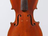 a close up of a violin on a white background with a white background