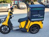 a yellow scooter parked on the side of the road