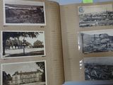 an open book with a bunch of pictures on it sitting on top of a table