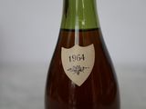 a bottle of wine sitting on a table with a label on it