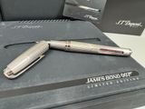 a silver pen sitting on top of a black box