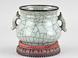 a white vase with a cracky design on it