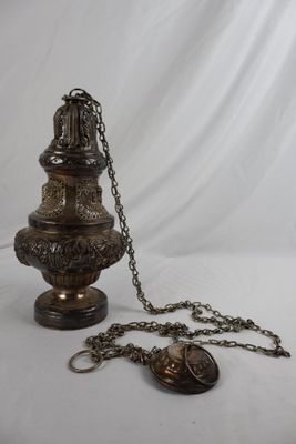 antique brass oil lamp with chain and key on white background