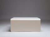 white plastic box on a white surface with a gray background
