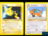 two pokemon cards with a picture of a yellow dragon and a yellow dragon
