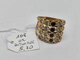 a close up of a ring on a white surface with a price tag