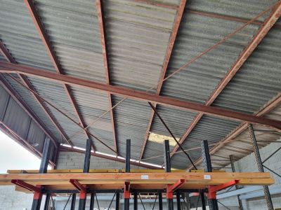 a picture of a large warehouse with a metal roof