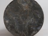 an image of a black plate sitting on top of a white surface