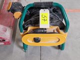 a small child ' s chair and a skateboard on the floor