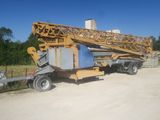 a crane that is sitting on the back of a truck