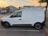 a white van that is parked in a parking lot