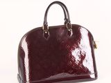 a picture of a red handbag on a white background