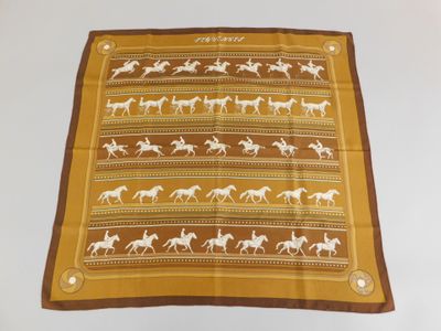 a brown and white scarf with horses on it
