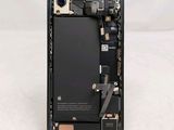 an image of a close up of a cell phone with a broken battery