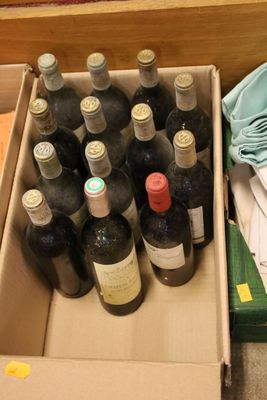 many bottles of wine in a box on the floor