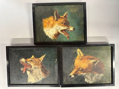 three framed paintings of a fox and a dog on a shelf