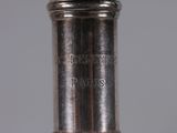 an antique silver plated wine bottle with a cork stopper on it