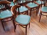 many chairs that are lined up on the floor