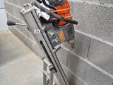 a machine that is sitting on a stand next to a wall