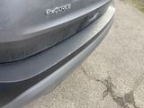 a close up of a car ' s rear bumper