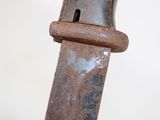 a rusted metal object with a hole in the middle of it