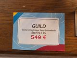 a sign that says guild on the side of a table