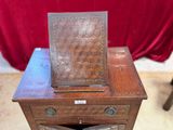 a small wooden table with a drawer on top of it