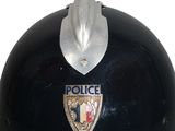 a black helmet with a police badge on it